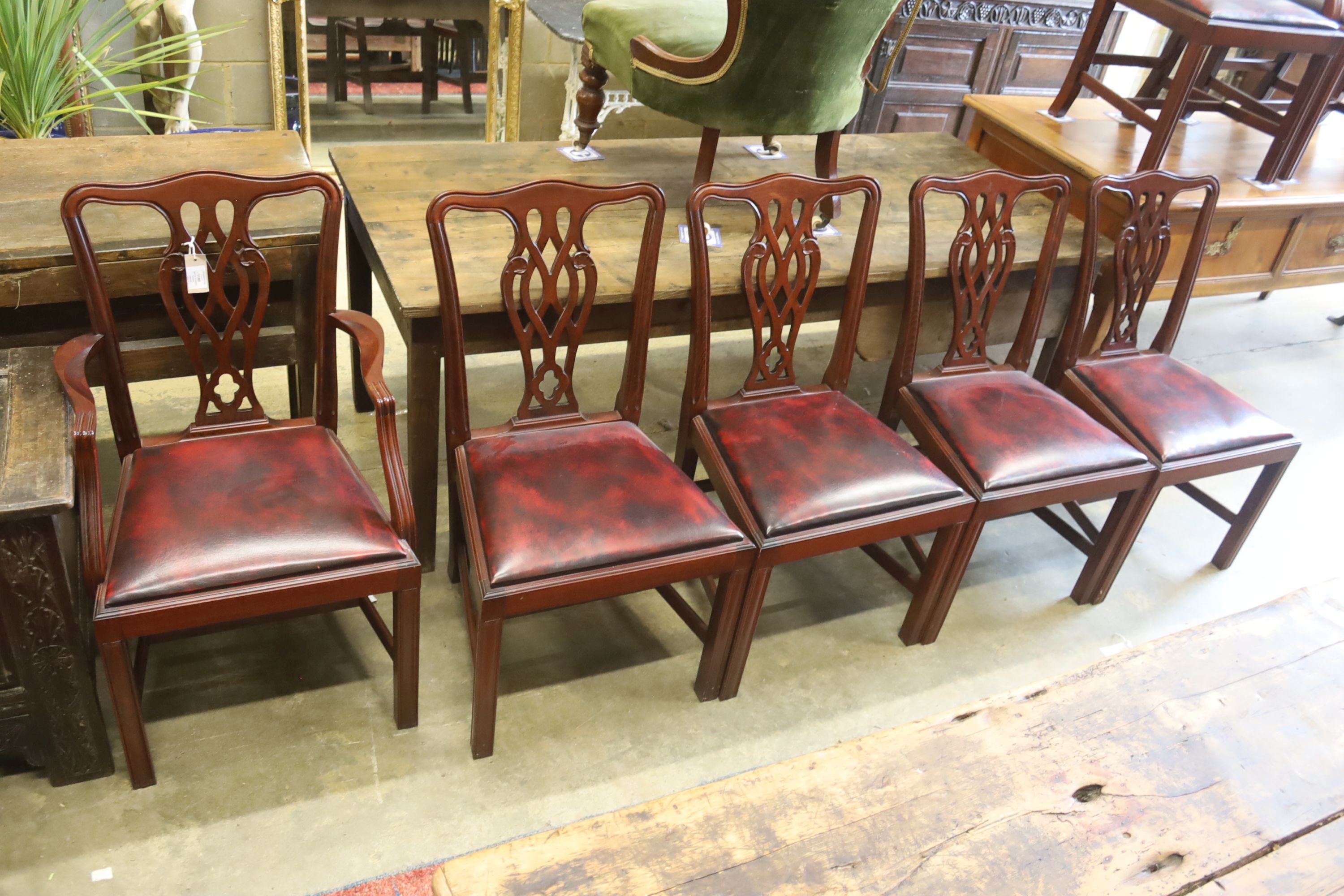 A set of eight Chippendale style mahogany dining chairs (2 arm, 6 single)